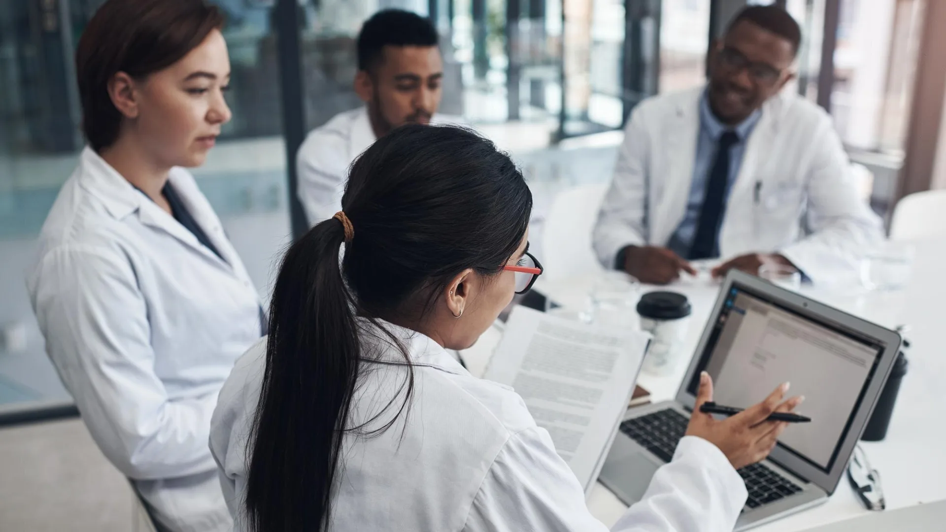 Healthcare technology professionals collaborating on digital systems