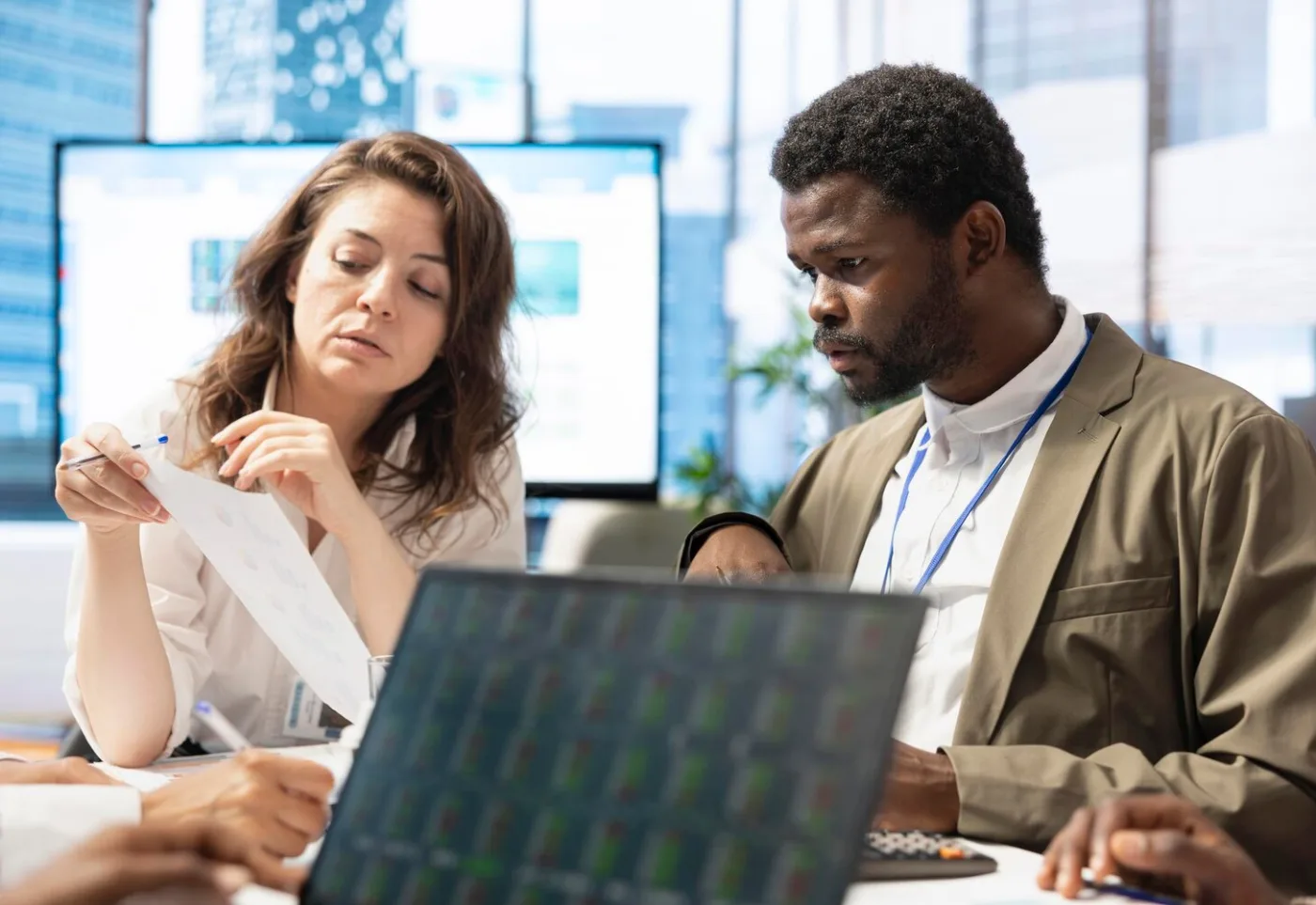 Professionals collaborating on technology decisions
